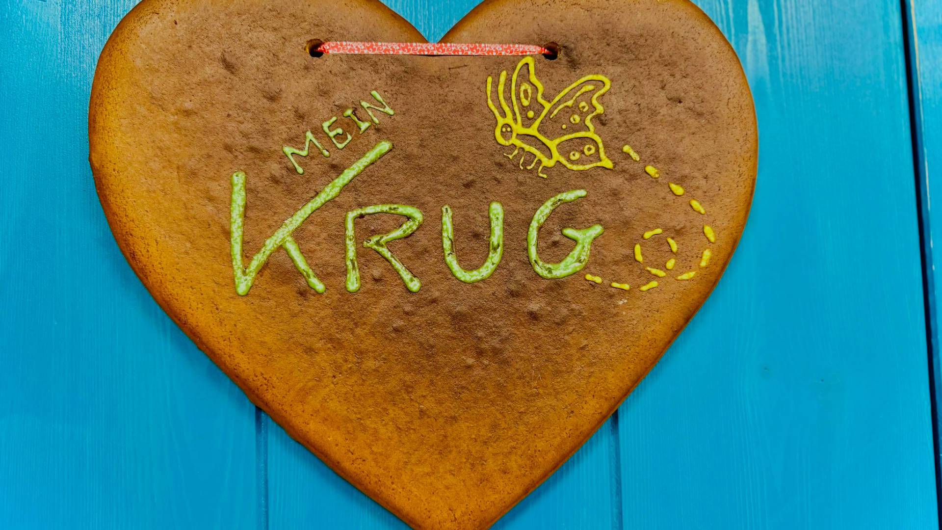 Selbstgemachtes Lebkuchenherz mit „Mein Krug“-Logo